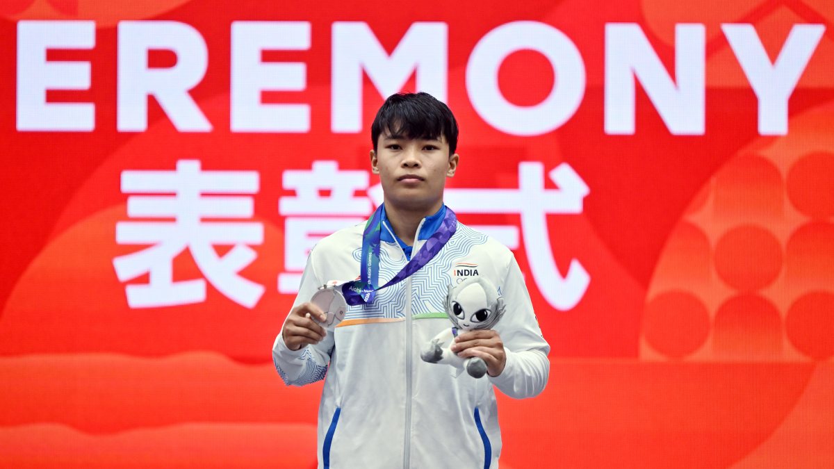 Roshibina Devi poses with silver medal at Asian Games