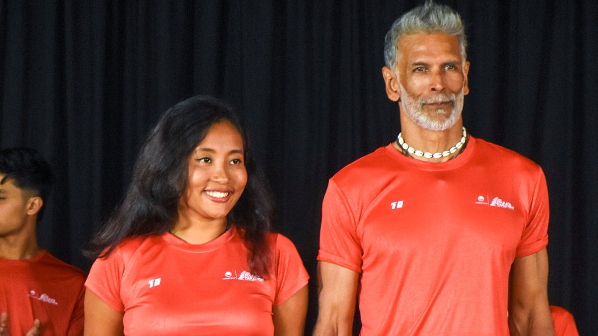 Milind Soman and Ankita Konwar pose at Kolkata marathon jersey launch