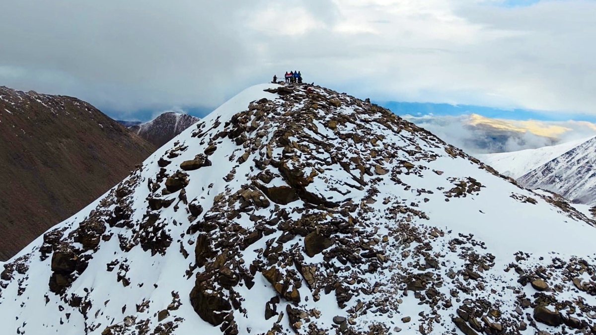 Nimas team displays national flag after summiting 20 unclimbed peaks