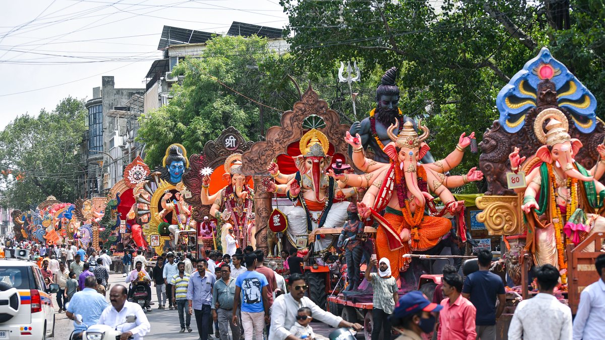 Devotees carry Ganesh idols for immersion in Akola