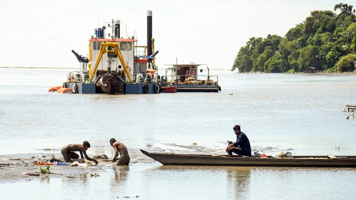 Fishermen catch fish in Brahmaputra River at Tezpur