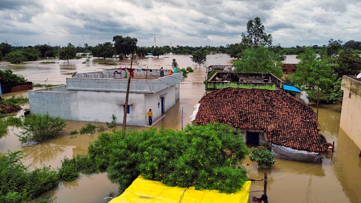 Floodwater surrounds homes in Raipur village
