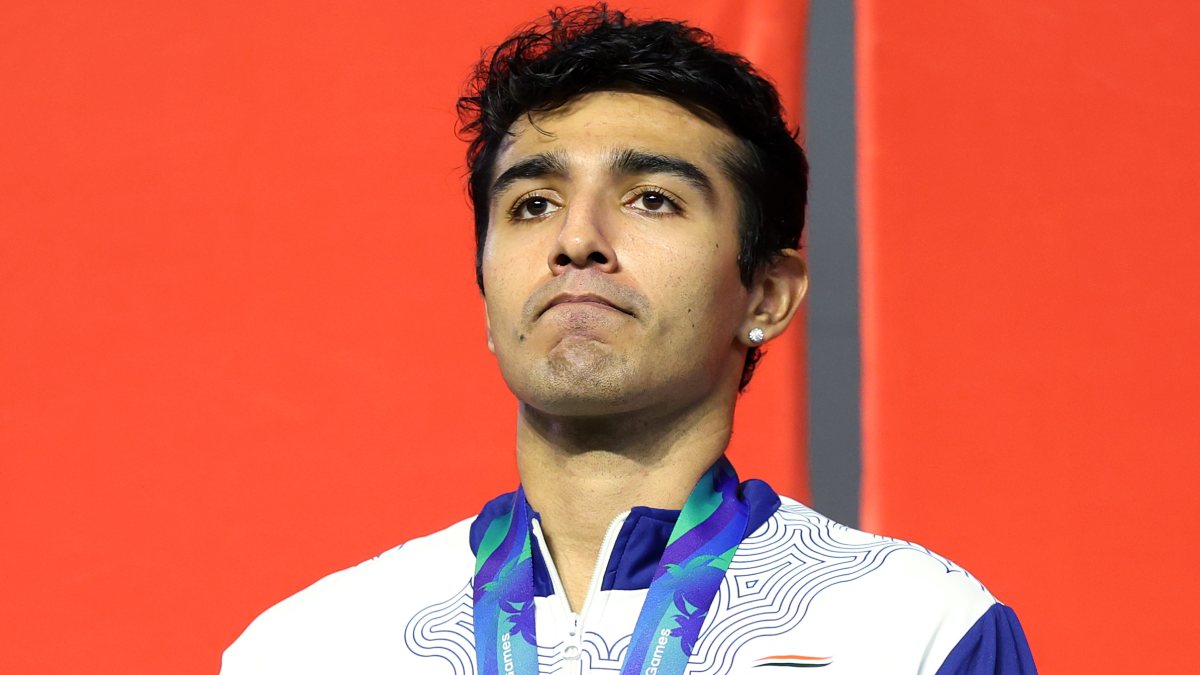 Abhay Singh poses with silver medal in men's squash at Asian Games