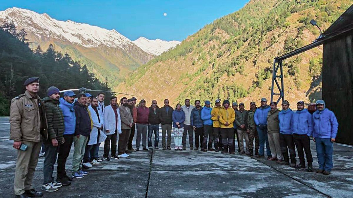 Rescued trekkers pose at Harsil helipad after Kalindi Pass rescue