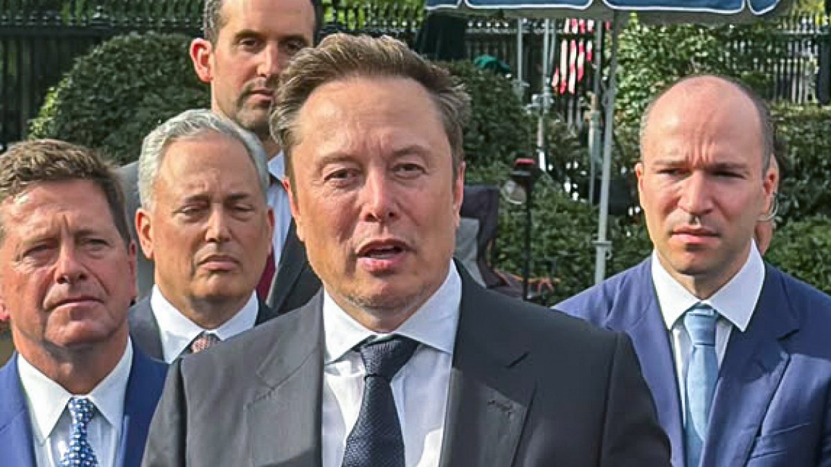 Elon Musk talks to media after Trump AI order signing