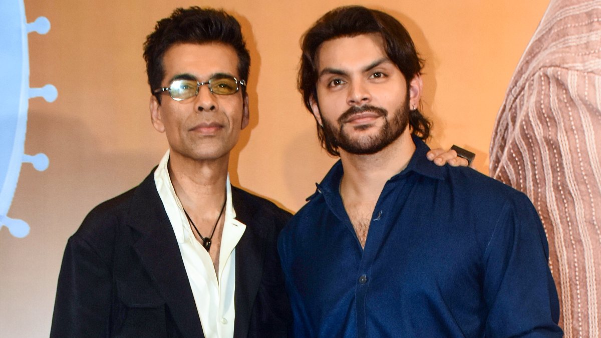 Karan Johar and Veer Pahariya pose at Prem Keetanu screening