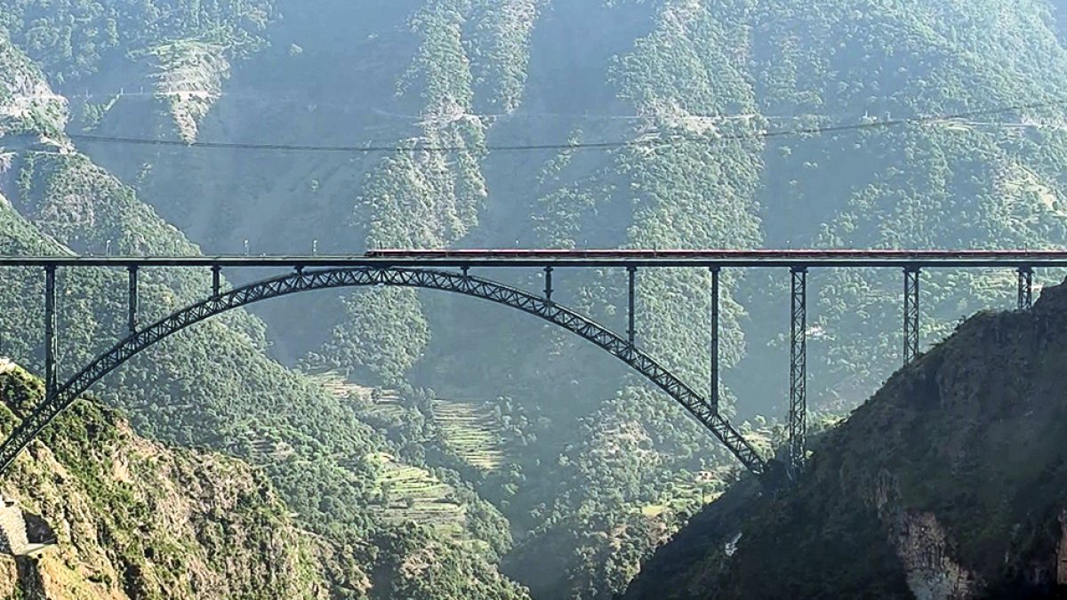 Vande Bharat train crosses Chenab rail bridge in Reasi