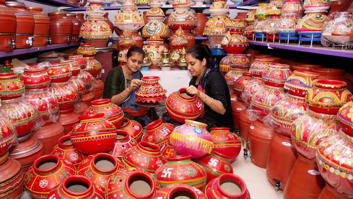 Women prepare Garba light pots for Navaratri in Surat