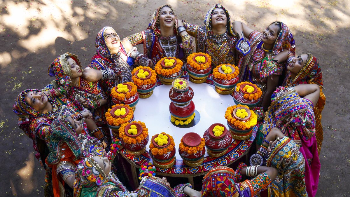 Artists rehearse Garba around pots ahead of Navaratri in Ahmedabad