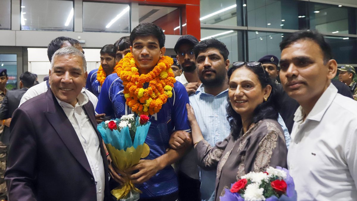 Indian boxer Ankush Panghal poses at New Delhi airport