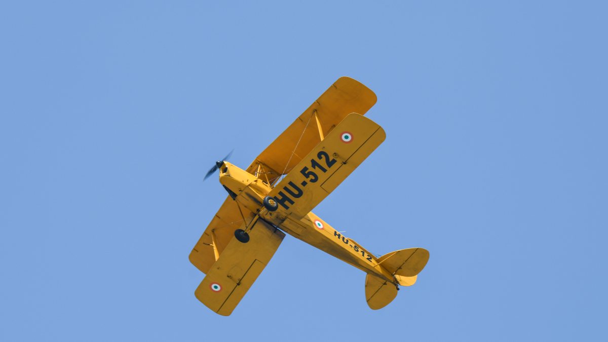Vintage Tiger Moth aircraft flies past during Air Force Day rehearsal