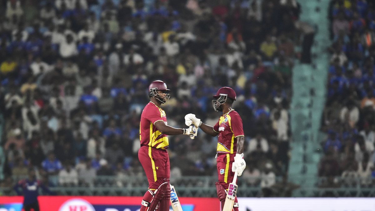 West Indies Romario Shepherd and teammate celebrate partnership in Lucknow T20I