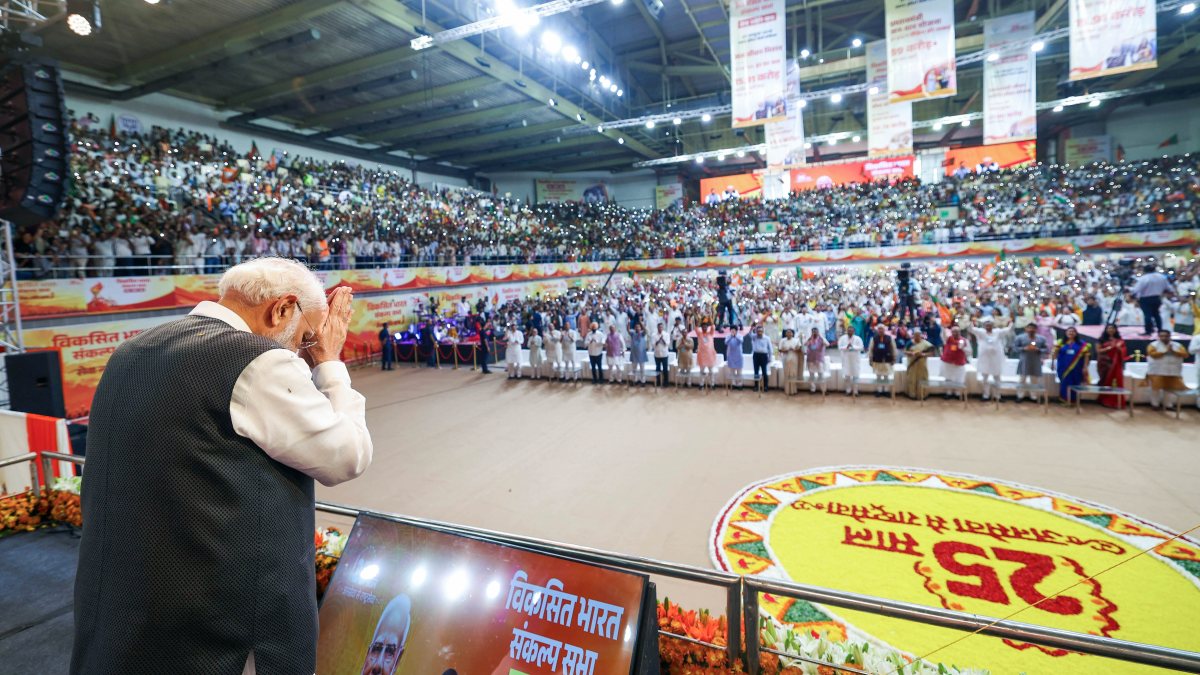 PM Modi greets crowd at Viksit Bharat Sankalp Sabha in Delhi