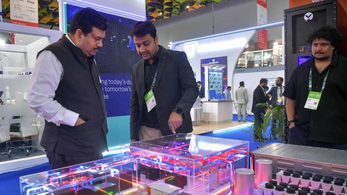 Visitors explore stalls at India Mobile Congress in New Delhi