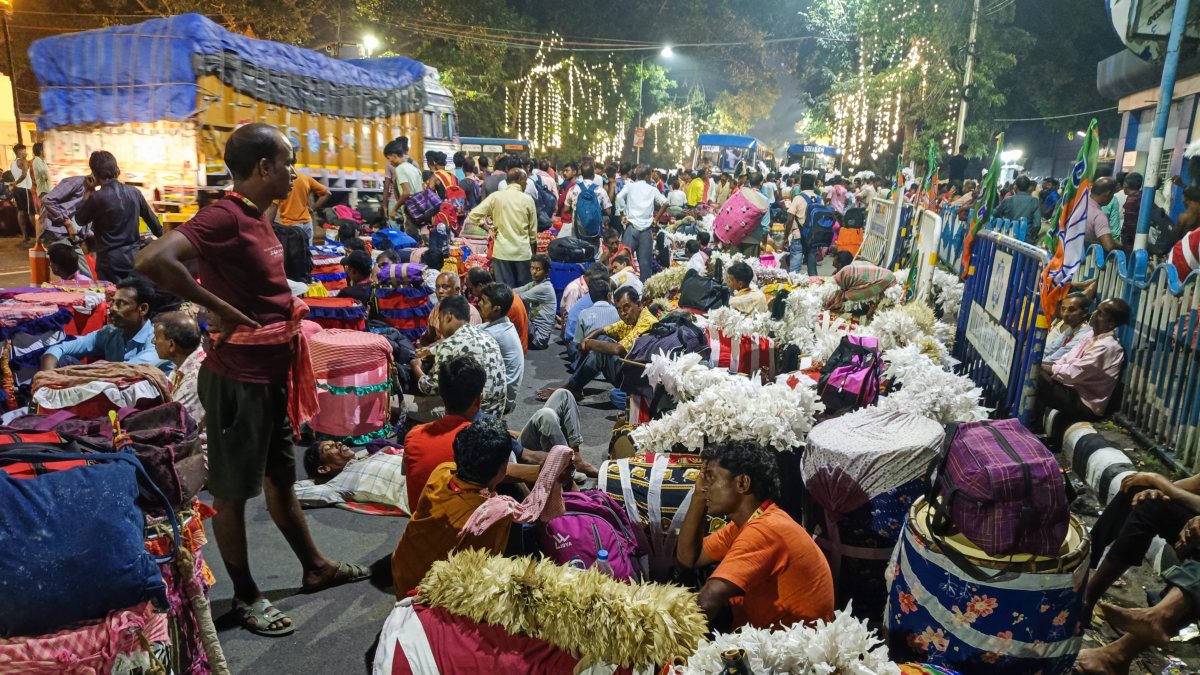 Dhakis sit near Netaji Indoor Stadium ahead of Durga Puja opening