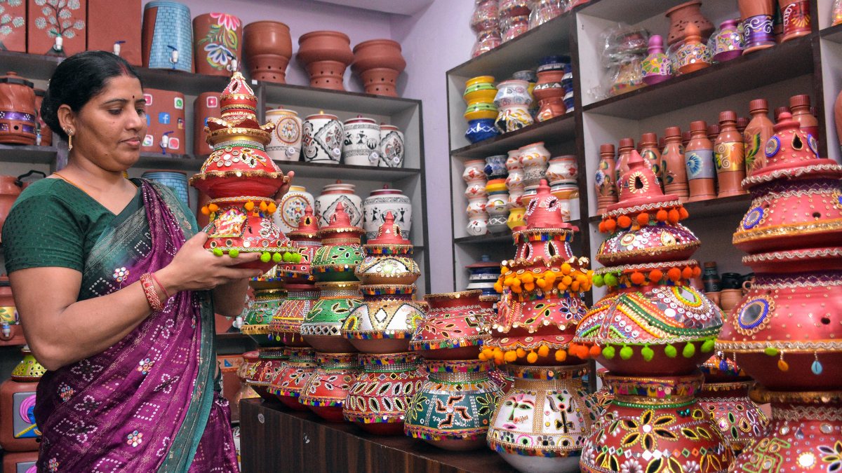 Woman shops for Garba pots ahead of Navratri in Surat