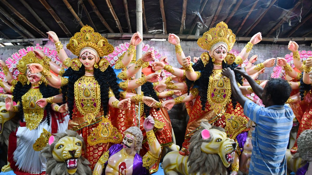 Artisan gives finishing touches to Durga idol in Prayagraj