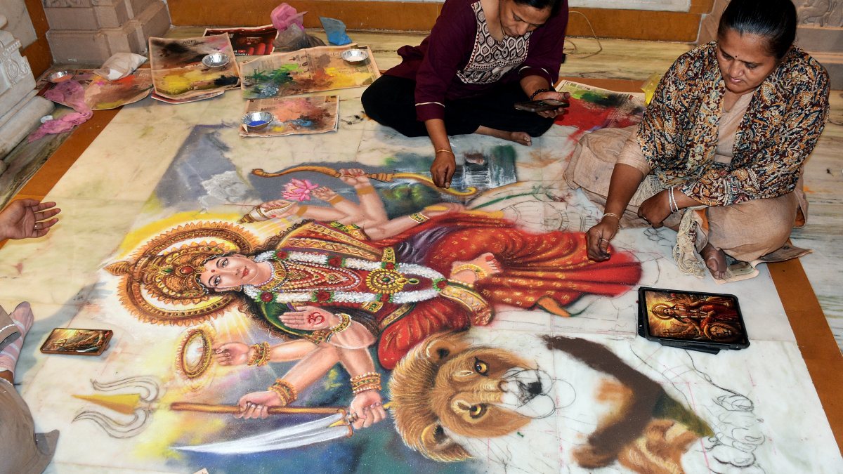 Women make Durga rangoli ahead of Navratri in Surat