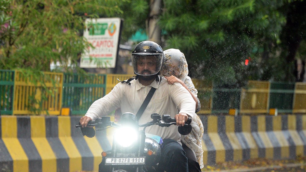 Motorcyclist wades through flooded Jalandhar road amid heavy rain