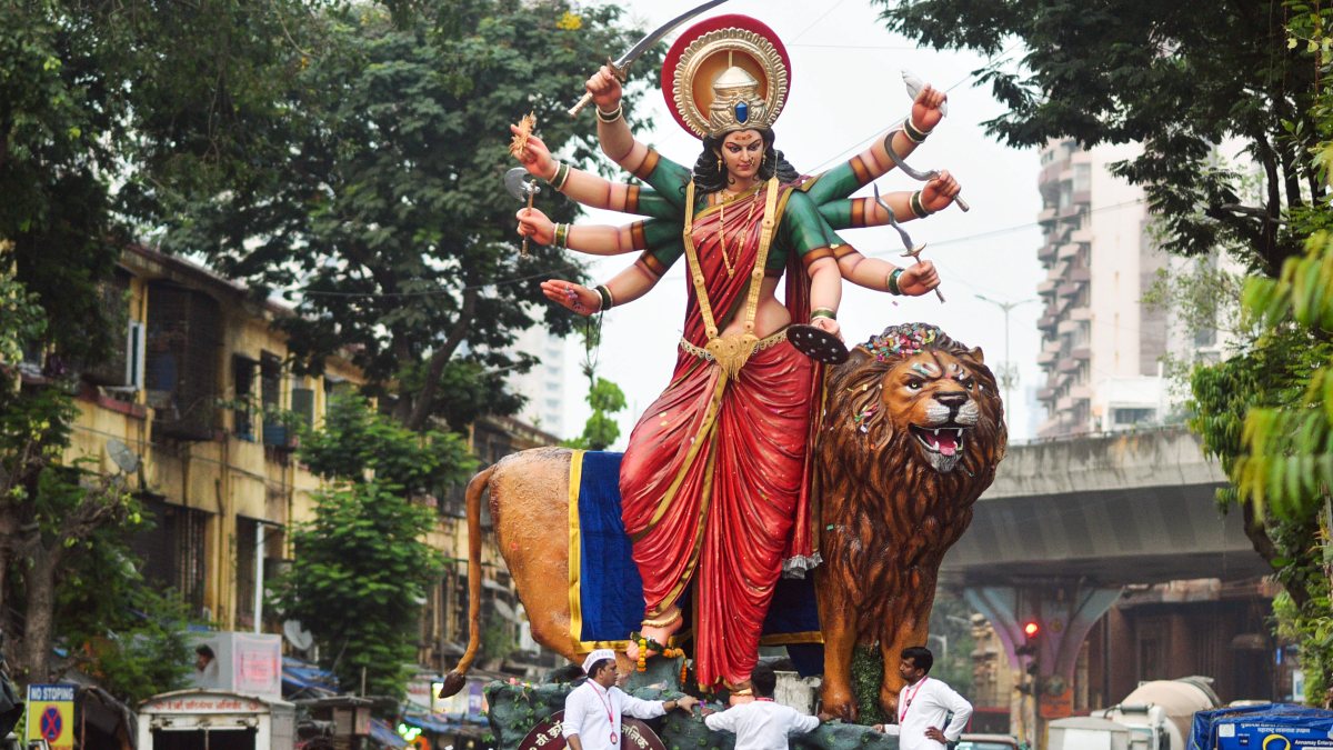 Devotees accompany Durga idol in Mumbai Navratri procession
