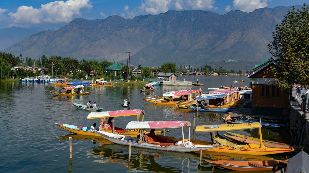 Tourists enjoy shikara ride on Dal Lake in sunny Srinagar