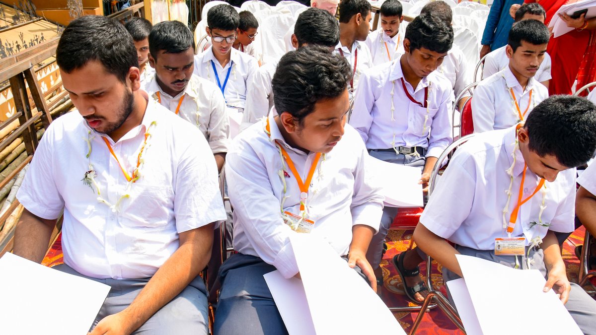 Blind students read Braille book at Kolkata Durga Pandal