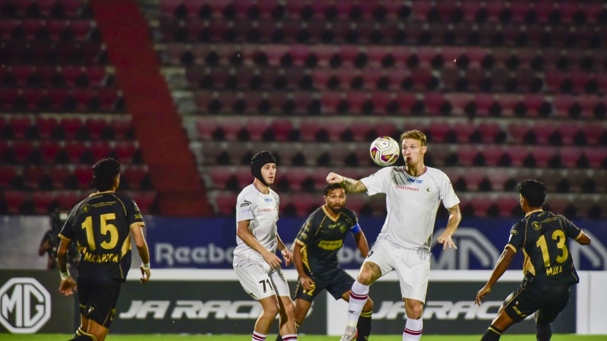 NorthEast United and Mohun Bagan players compete for ball in ISL match