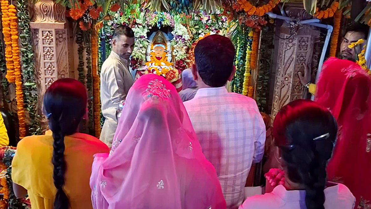 Devotees pray at Chandi Devi Temple on Navratri day three