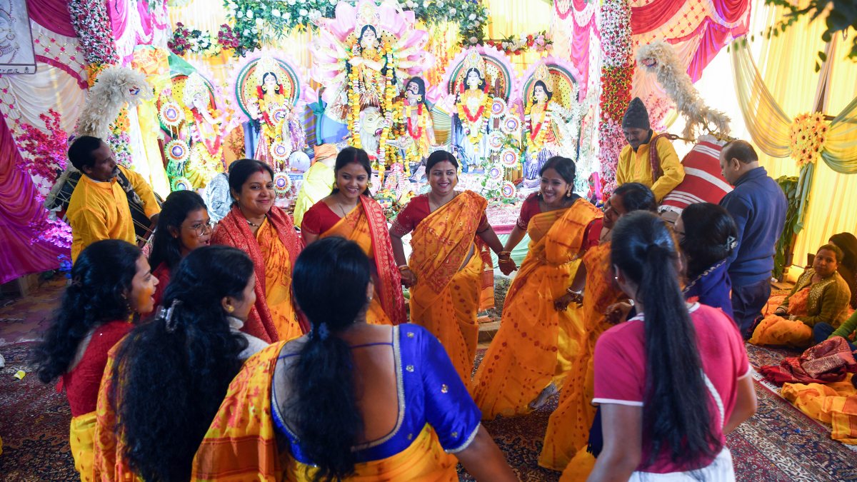 Devotees dance at Durga Puja pandal in Srinagar