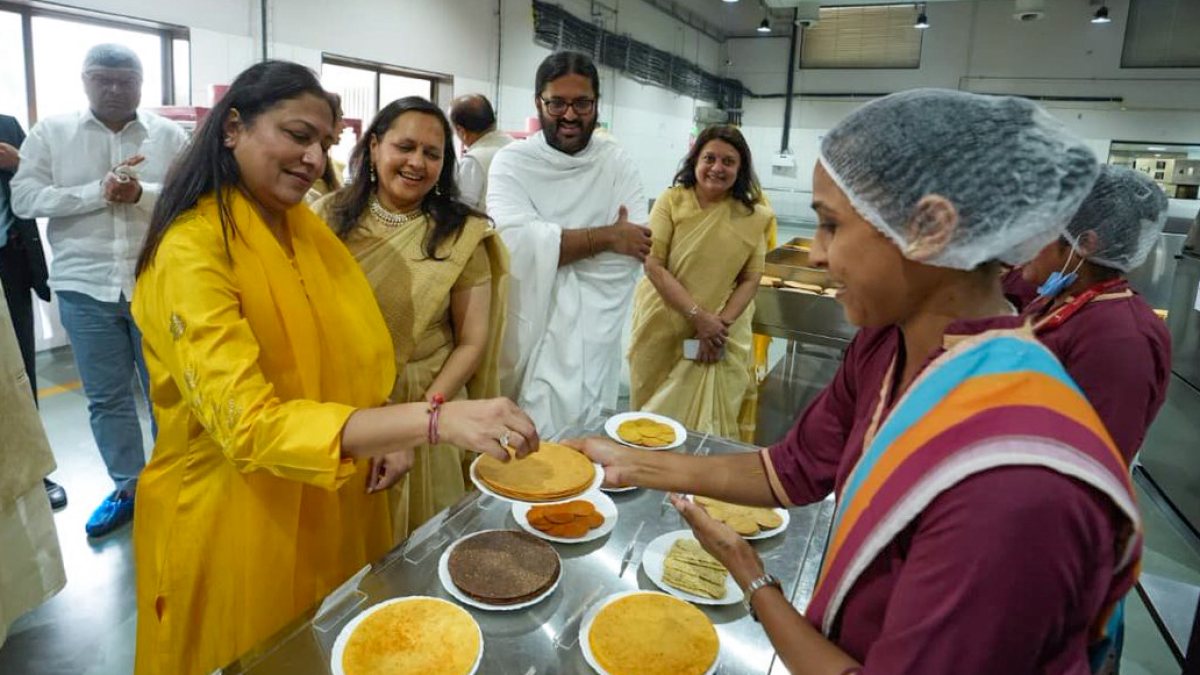 Priti Adani and Rakeshji try food at Gujarat ashram