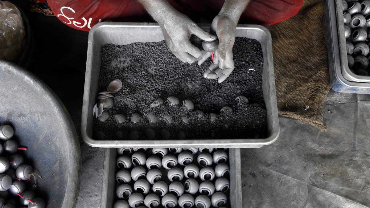 Worker makes crackers for Diwali at Ahmedabad factory
