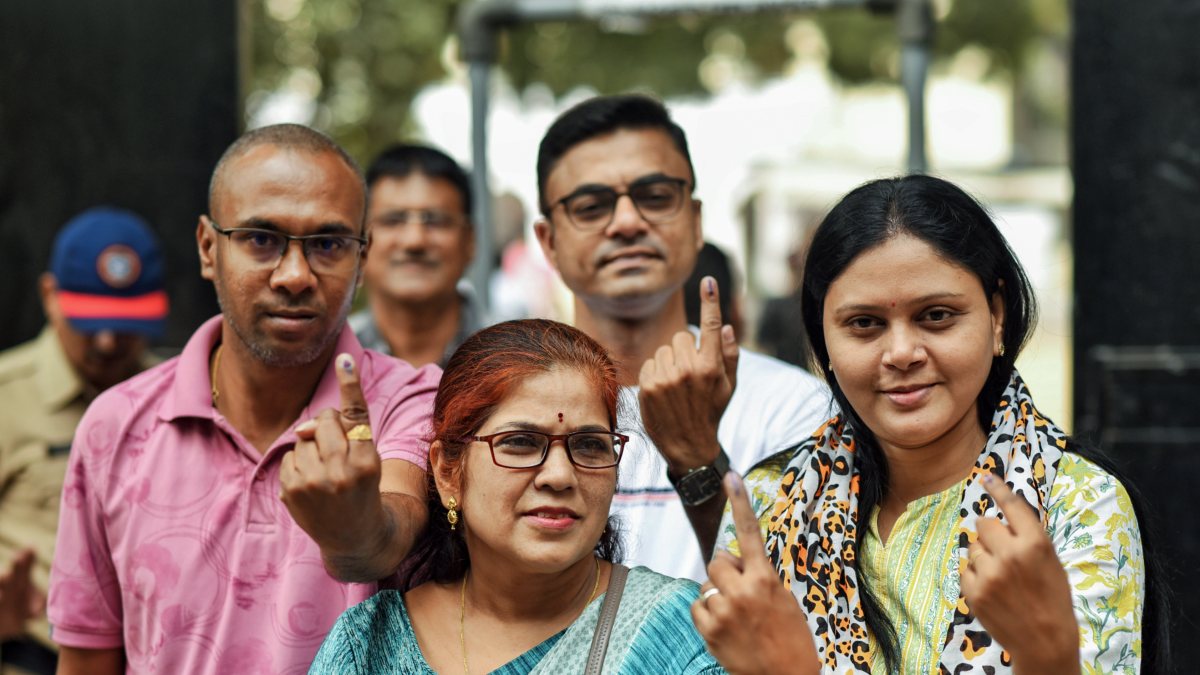 Voters show inked fingers after casting votes in Nagpur council polls