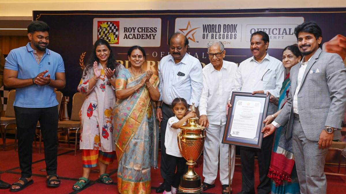 Three-year-old chess prodigy Mahika Nandepu poses with trophy in Hyderabad
