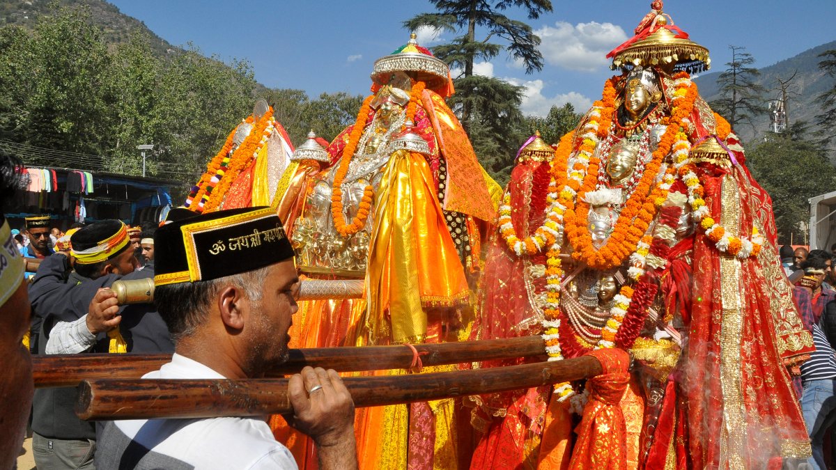 Devotees carry deity palanquins on day three of Kullu Dussehra