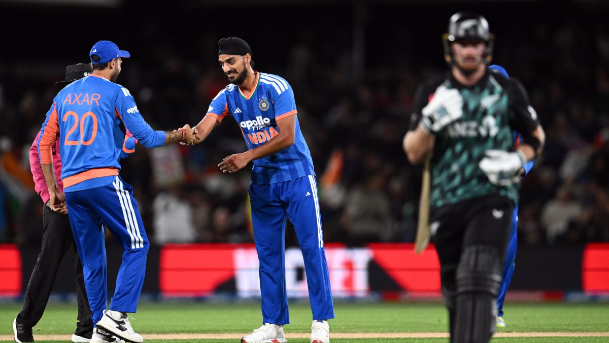 Axar and Arshdeep celebrate Phillips wicket in Christchurch