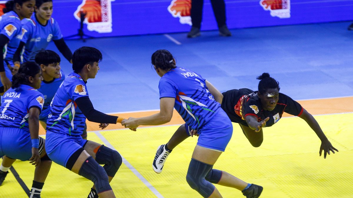 Uganda raider in action against India at kabaddi championship