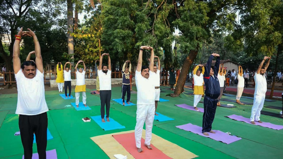 MP CM Mohan Yadav performs yoga with Gayatri Dham members in Barwani
