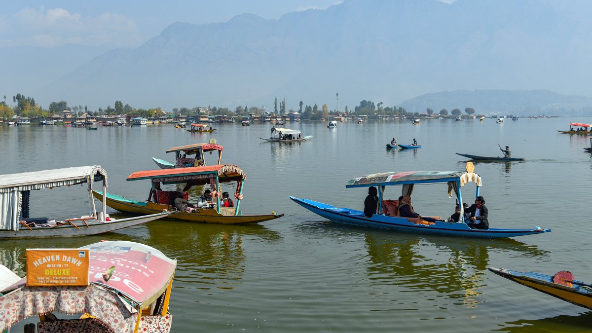 Tourists enjoy Shikara rides on Dal Lake in Srinagar