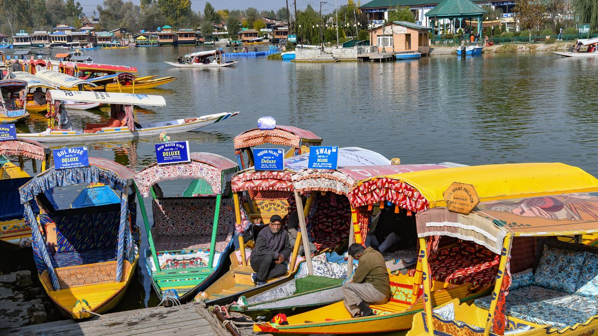 Anchored shikaras on Dal Lake on brisk morning in Srinagar