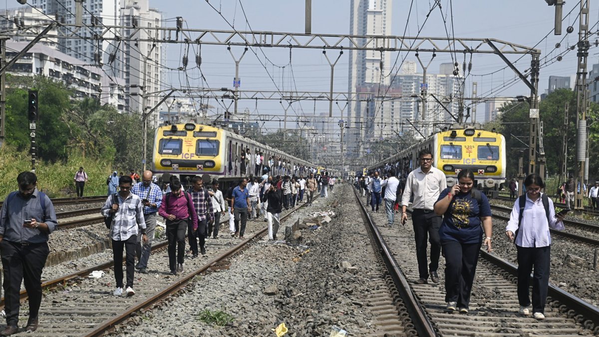 Mumbai commuters walk on tracks after signal failure halts train