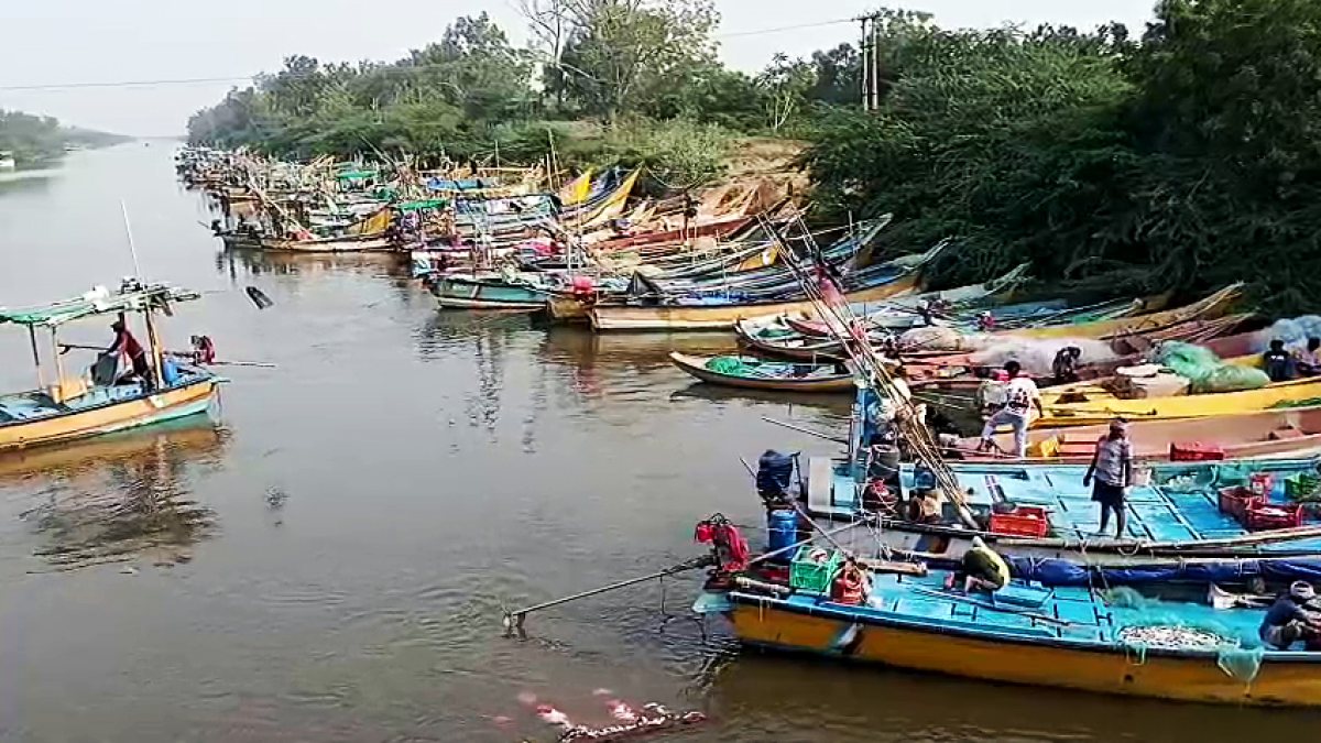 Fishing boats anchored at Suryalanka Beach as Cyclone Arnab halts activity