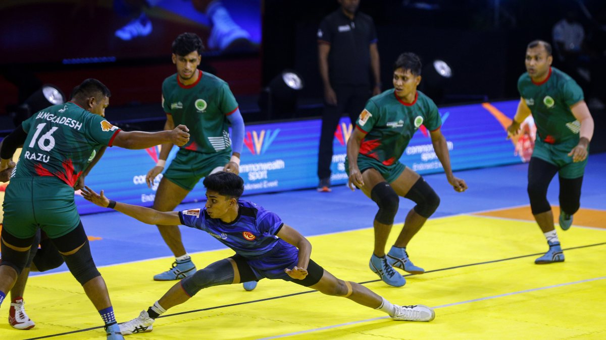 Singapore raider takes on Bangladesh defence at kabaddi championship