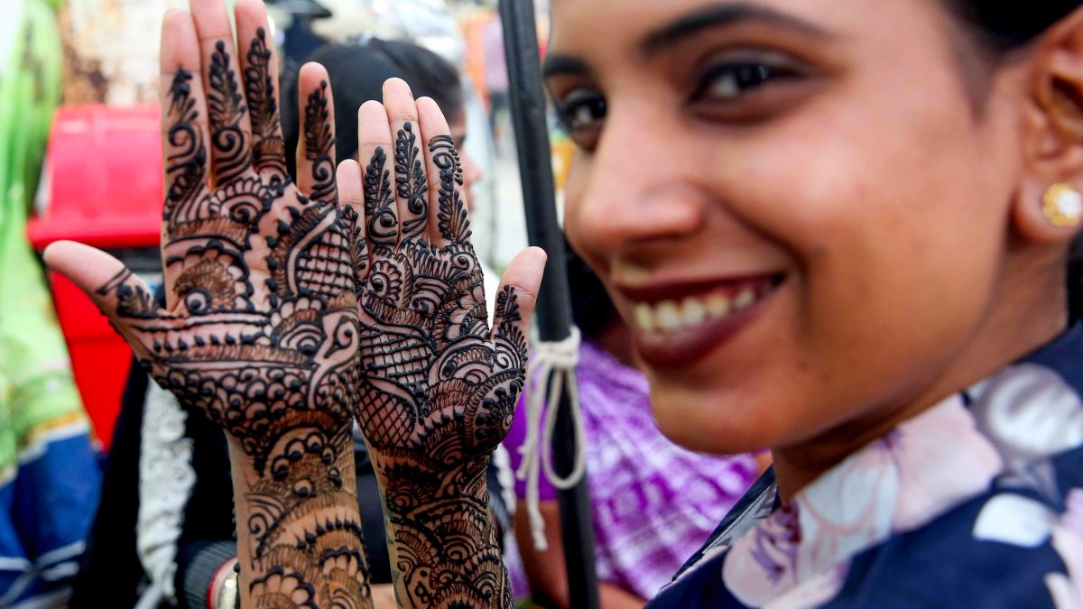 Bhopal woman shows henna-decorated hands ahead of Karva Chauth