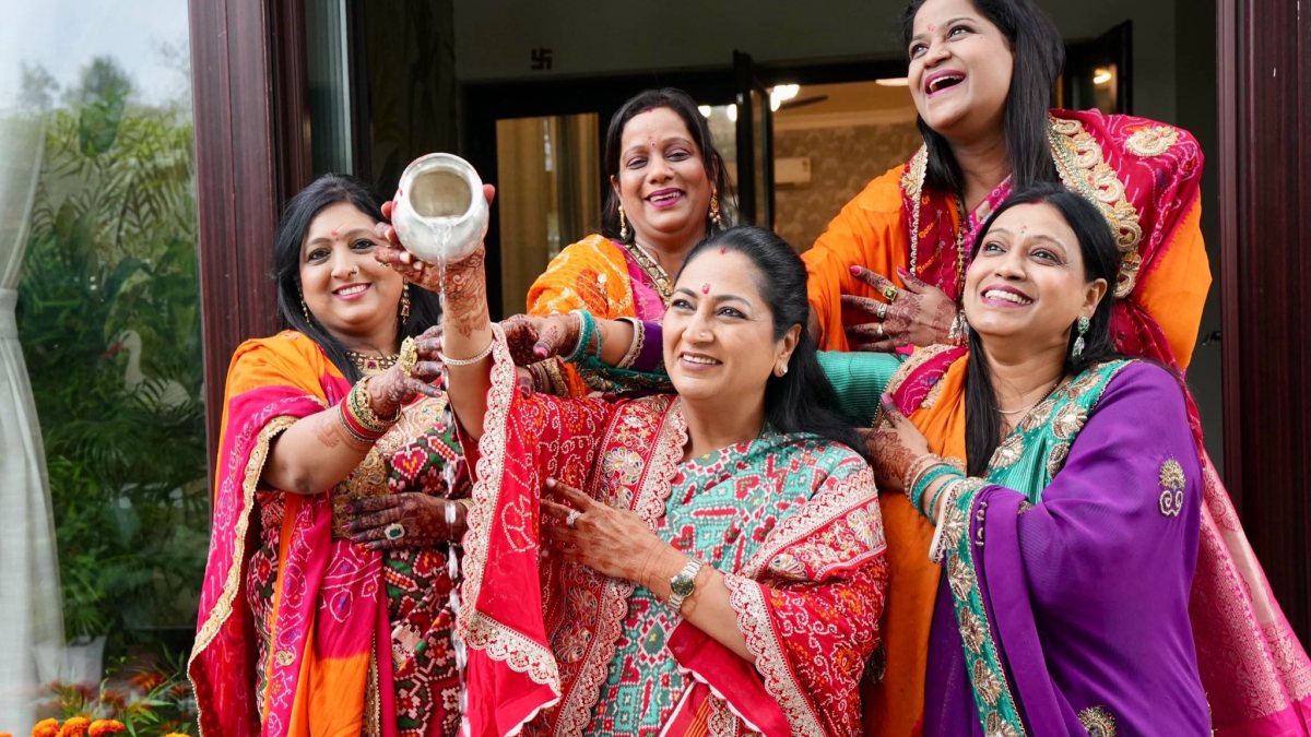 Delhi CM Rekha Gupta performs Karwa Chauth ritual with women